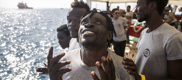 Des migrants Des migrants - Sputnik Afrique