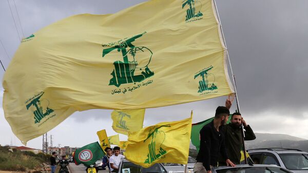 Des partisans du mouvement chiite libanais Hezbollah  - Sputnik Afrique