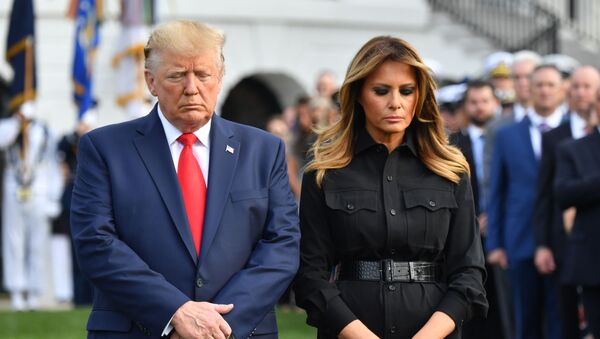 US President Donald Trump and First Lady Melania Trump observe a moment of silence at the White House to mark the 18th anniversary of the 9/11 attacks, on September 11, 2019, in Washington, DC. (Photo by Nicholas Kamm / AFP) - Sputnik Afrique