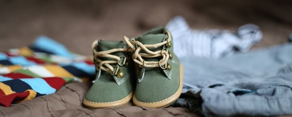 Chaussures d'enfant (image d'illustration) - Sputnik Afrique