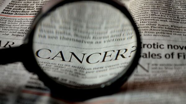 Inscription «cancer» dans un journal - Sputnik Afrique