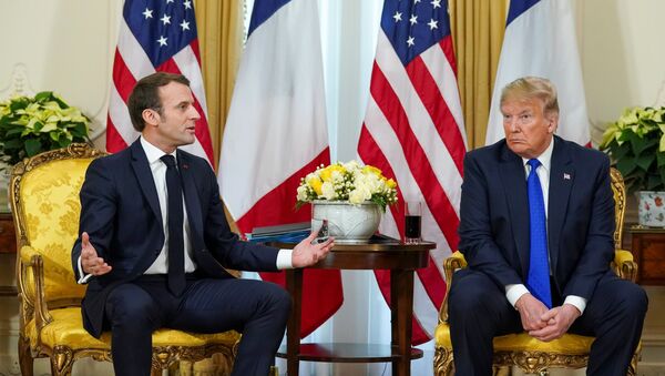 U.S. President Donald Trump looks on as France's President Emmanuel Macron talks, during a meeting ahead of the NATO summit in Watford, in London, Britain, December 3, 2019 - Sputnik Afrique