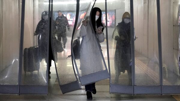 Habitants de Pékin portant des masques de protection - Sputnik Afrique