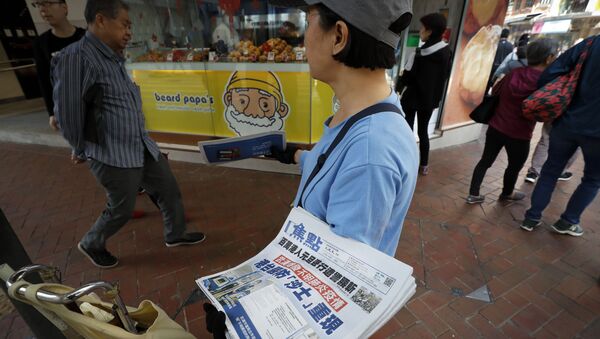 La vente des journaux avec les actualités sur la propagation du coronavirus - Sputnik Afrique