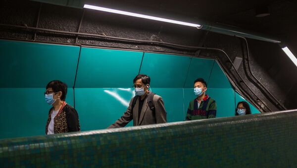 Des personnes portant des masques pour se protéger du coronavirus. - Sputnik Afrique