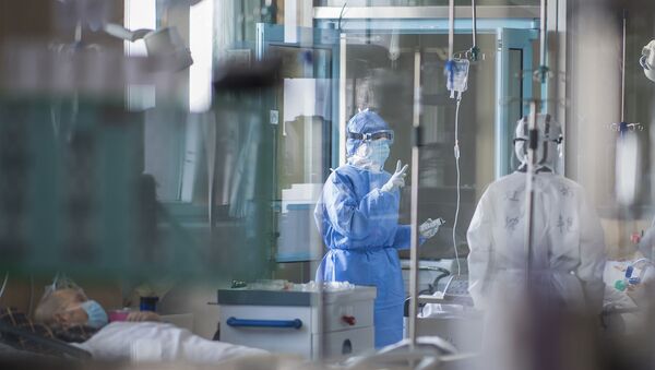 Des malades du Covid-19 dans un hôpital à Wuhan - Sputnik Afrique