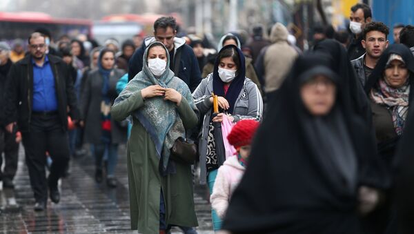 Iranian women wear protective masks to prevent contracting a coronavirus, as they walk at Grand Bazaar in Tehran, Iran February 20, 2020. - Sputnik Afrique