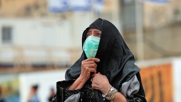 Una mujer con una mascarilla en Jerusalén - Sputnik Afrique