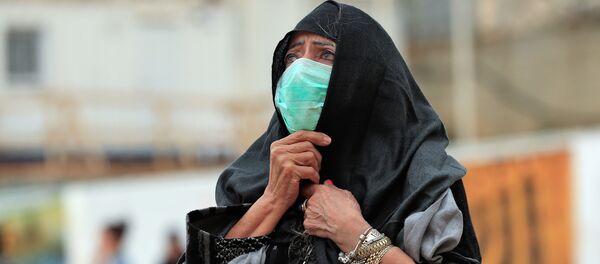 Una mujer con una mascarilla en Jerusalén Una mujer con una mascarilla en Jerusalén - Sputnik Afrique