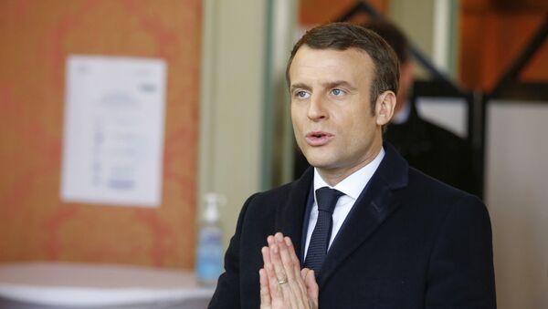 French President Emmanuel Macron gestures after voting for the first round of the mayoral elections in Le Touquet, northern France, Sunday March 15, 2020. France is holding nationwide elections Sunday to choose all of its mayors and other local leaders despite a crackdown on public gatherings because of the new virus - Sputnik Afrique