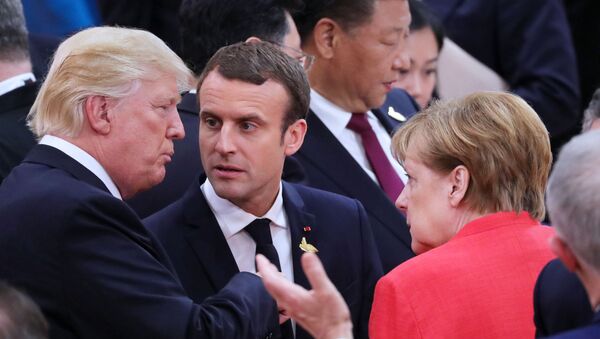Donald Trump, Emmanuel Macron et Angela Merkel lors du Sommet G20 - Sputnik Afrique