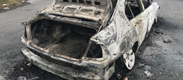 Une voiture incendiée - Sputnik Afrique