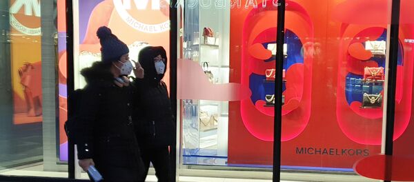 Des gens portant des masques à Pékin - Sputnik Afrique