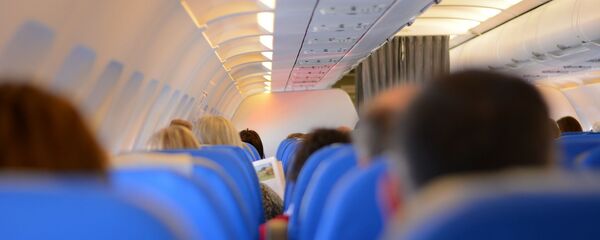 Passagers dans un avion - Sputnik Afrique