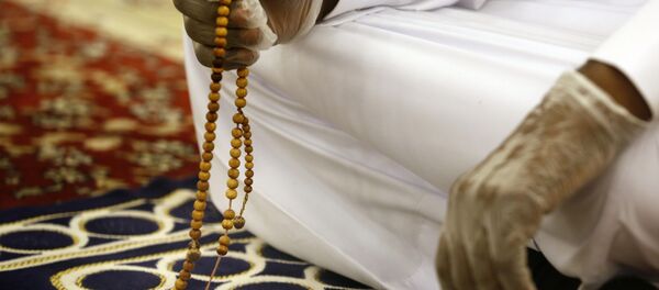 Un fidèle - Sputnik Afrique