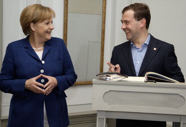 La chancelière allemande Angela Merkel et le président russe Dmitri Medvedev . Les archives - Sputnik Afrique