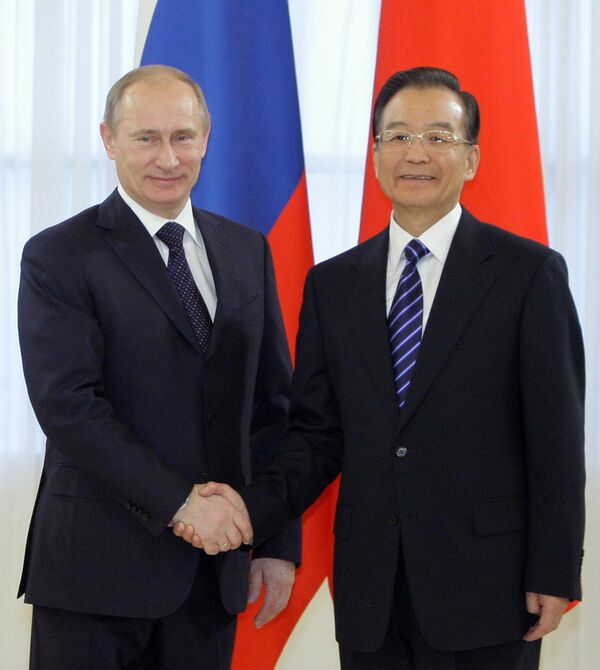 Le premier ministre russe Vladimir Poutine et son homologue chinois Wen Jiabao - Sputnik Afrique