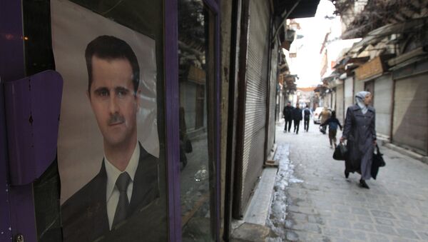 Le portrait du président syrien Bachar el-Assad, Damas. Archive photo - Sputnik Afrique