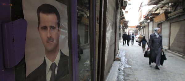 Le portrait du président syrien Bachar el-Assad, Damas. Archive photo - Sputnik Afrique