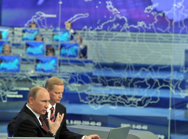Premier ministre russe Vladimir Poutine lors d'une séance annuelle de questions-réponses avec la population - Sputnik Afrique