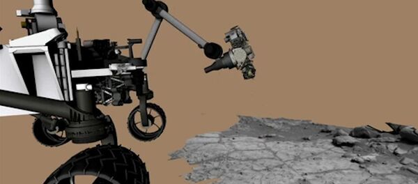 Le robot Curiosity fore une roche sur Mars. Reconstitution animée - Sputnik Afrique