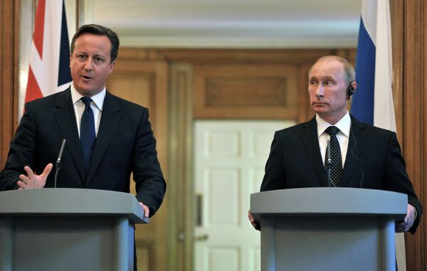 Premier ministre britannique David Cameron et président russe Vladimir Poutine - Sputnik Afrique