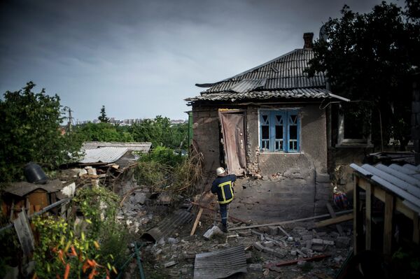 Une maison endommagée par des tirs d'artillerie - Sputnik Afrique