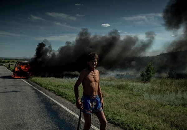 Ukraine: les incendies et les obus qui n'ont pas explosé dans les rues de Lougansk - Sputnik Afrique