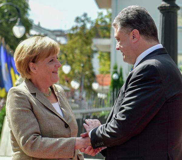 Angela Merkel et Piotr Porochenko - Sputnik Afrique