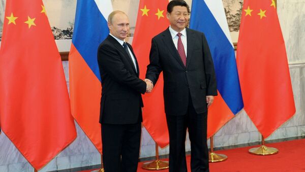 Vladimir Poutine et Xi Jinping le 9 novembre 2014 - Sputnik Afrique