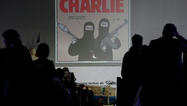 The coffin of late satirical French magazine Charlie Hebdo cartoonist Bernard Verlhac, know as Tignous, is seen during a tribute at Montreuil town hall, near Paris, January 15, 2015. - Sputnik Afrique
