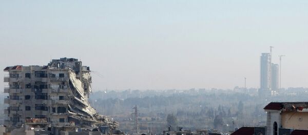 A general view shows damaged buildings in the northwestern Homs district of Al Waer January 18, 2015. - Sputnik Afrique